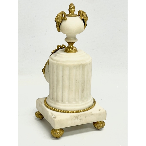 236 - A late 19th century French marble mantle clock with brass mounts and enamel face. 11x11x23.5cm