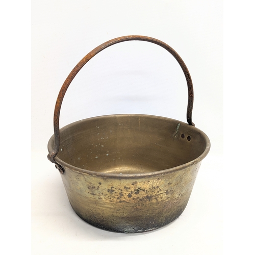 268 - A Victorian brass jam pan. 34x35cm