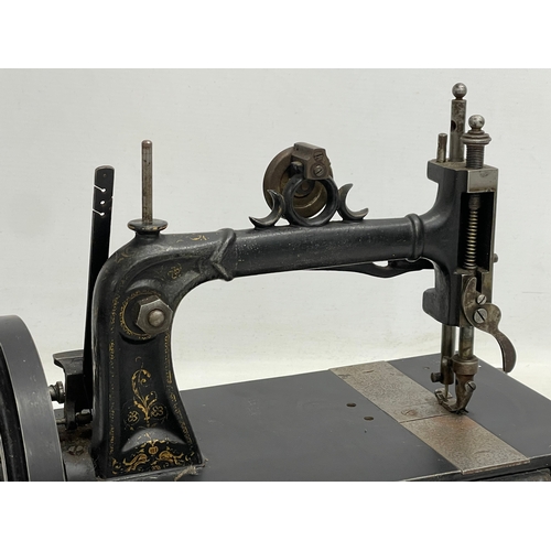 266 - A late 19th century sewing machine. 42x22x28cm