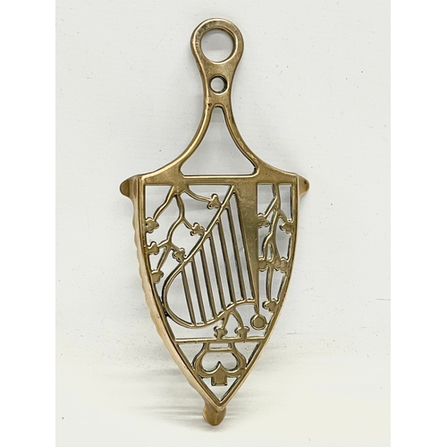 168 - A late 19th century Irish crowned harp brass stand. 25cm