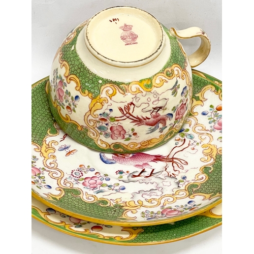 289 - A Mintons ‘Cockatrice’ tea cup and saucers. Circa 1873-1912.