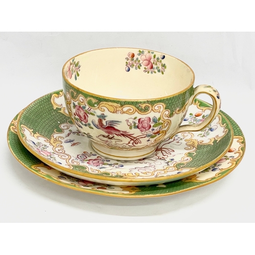 289 - A Mintons ‘Cockatrice’ tea cup and saucers. Circa 1873-1912.