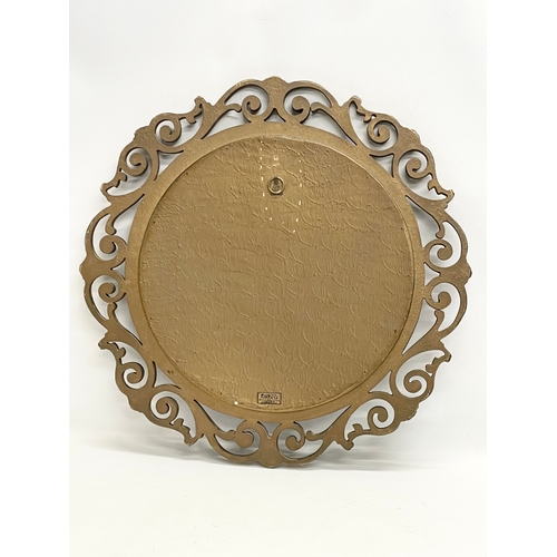 206 - A vintage ornate gilt framed convex mirror by Atsonea. 58cm