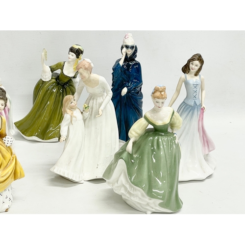 262 - A collection of 8 Royal Doulton figurines. 22cm.