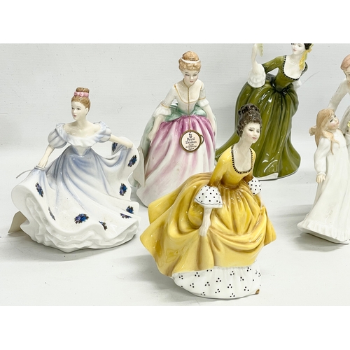 262 - A collection of 8 Royal Doulton figurines. 22cm.