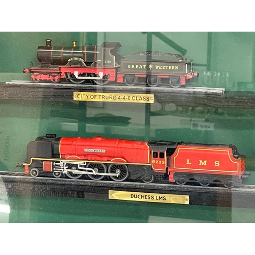 454 - Large framed model trains. 85x60cm