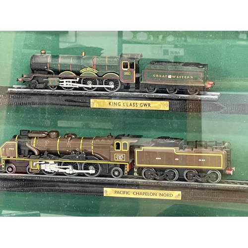 454 - Large framed model trains. 85x60cm