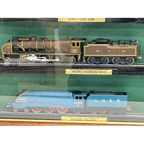 454 - Large framed model trains. 85x60cm