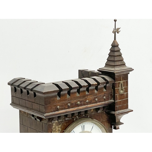 31 - A large 19th century Black Forest Junghans ‘Castle’ mantle clock. With pendulum. 33x19x53cm