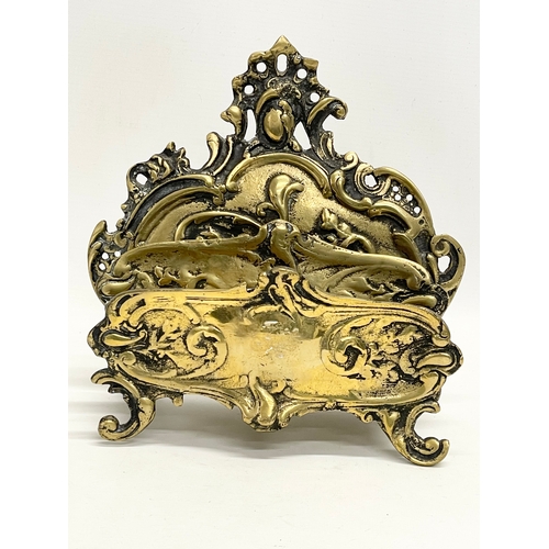 128 - An vintage French Rococo style brass letter rack. 25x13x24cm