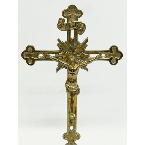 129 - A vintage brass crucifix. 29cm