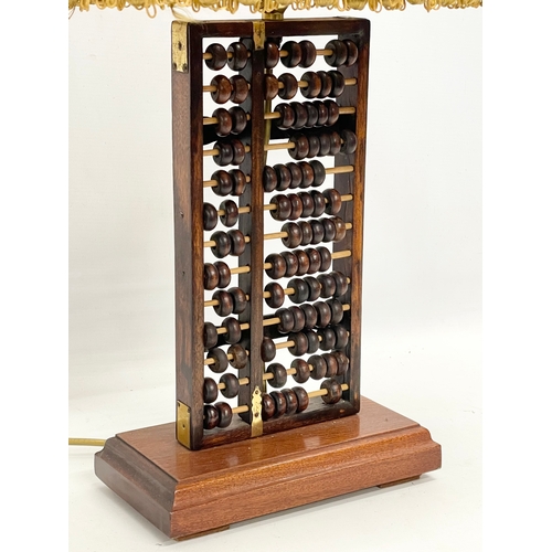 175 - A vintage Abacus table lamp. Base measures 23x12x38cm