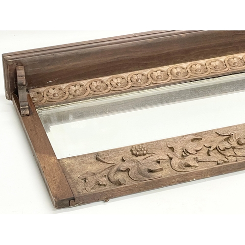 176 - A late 19th century fine proportioned carved oak over-mantle mirror with tree leaf and rosette mould... 