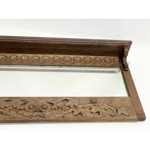 176 - A late 19th century fine proportioned carved oak over-mantle mirror with tree leaf and rosette mould... 