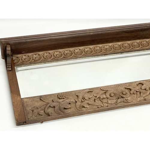 176 - A late 19th century fine proportioned carved oak over-mantle mirror with tree leaf and rosette mould... 