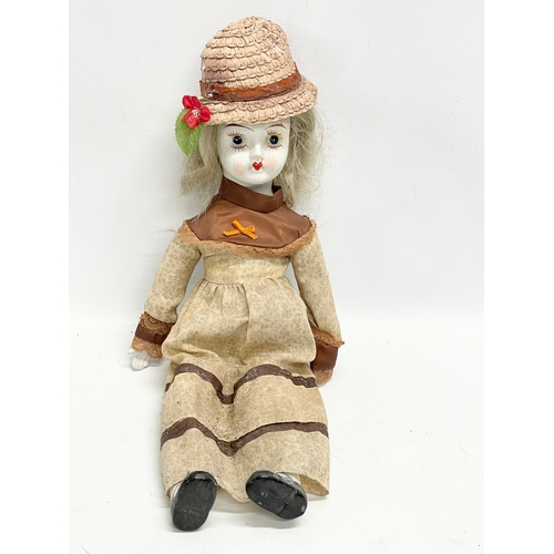 177 - A late 19th century rocking baby’s cradle with doll. 60cm