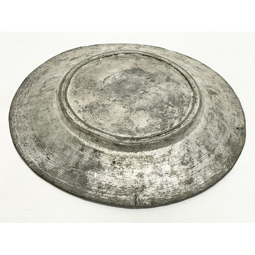 261D - A 19th century Middle Eastern pewter bowl. 27x4cm