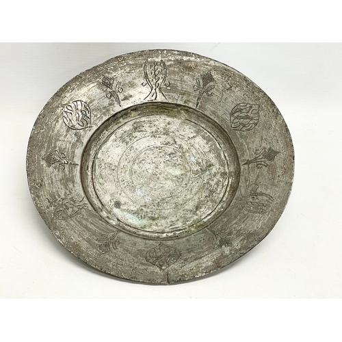 261D - A 19th century Middle Eastern pewter bowl. 27x4cm