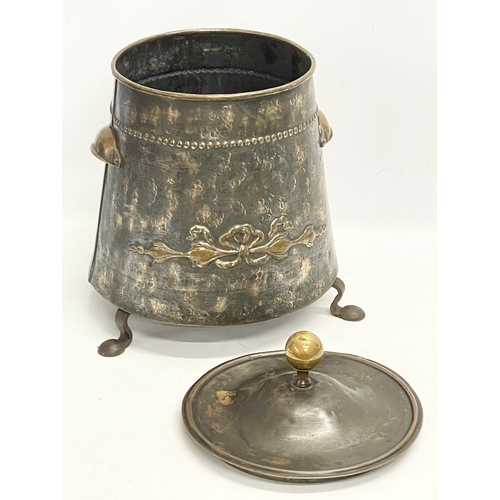 150T - An early 20th century Art Nouveau brass coal bin with lid. 35x36x44cm.