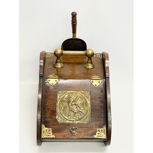 127A - An Edwardian brass bound coal scuttle. 31x45x34cm