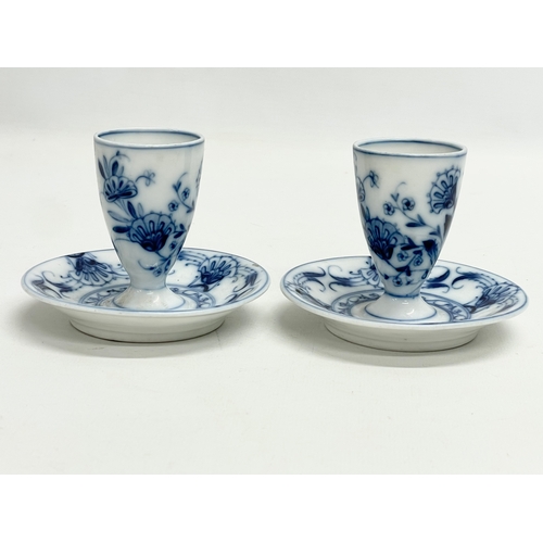 127F - A pair of late 19th century Fischer & Mieg, Pirkenhammer porcelain candleholders/egg cups. 10x8cm