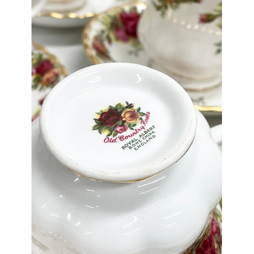 272F - A 39 piece Royal Albert ‘Old Country Roses’ tea set. Teapot 25x15x20cm. 12 sandwich plates, 12 tea c... 