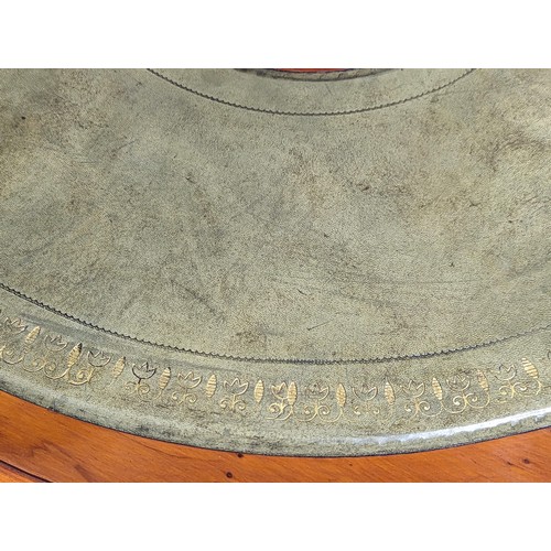 1130 - A Georgian style yew wood drum coffee table with leather top and pedestal base. 90x53cm