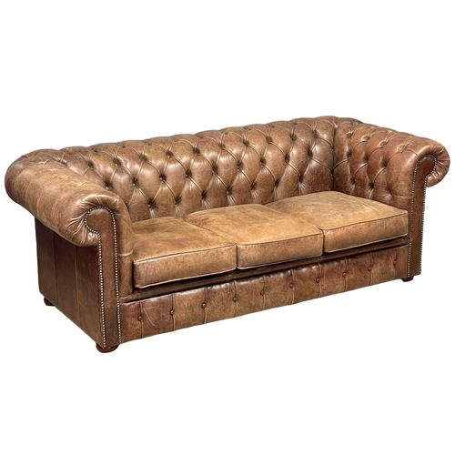 1001 - A deep button leather chesterfield 3 seater sofa.