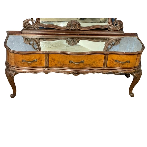 874 - An early 20th century French rococo style dressing table with 3 drawers on cabriole legs. 123x39x167... 