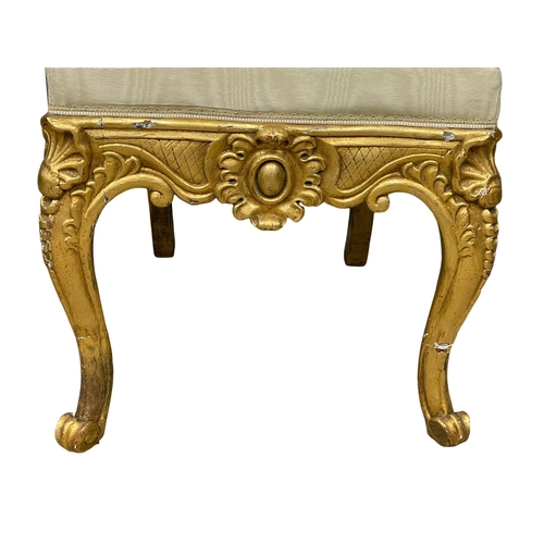 876 - A large late 19th century French heavy gilt hall chair. Circa 1890-1900.