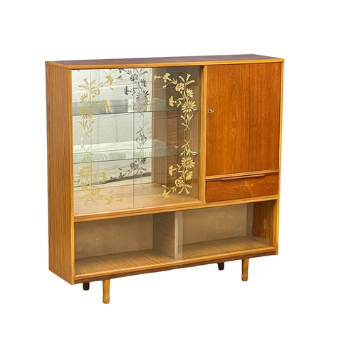 885 - A Mid Century teak china cabinet. 122x30x119cm