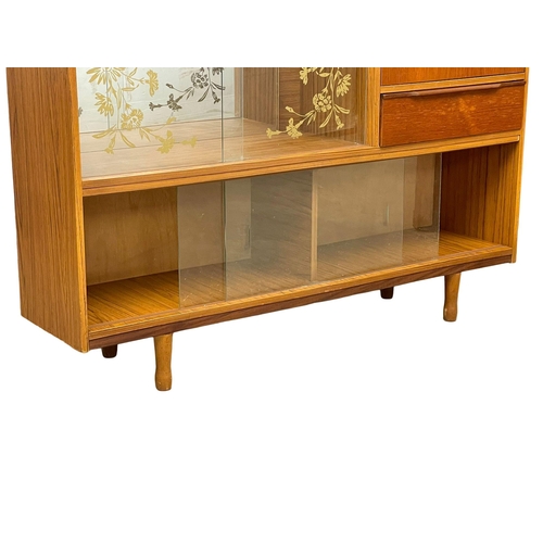 885 - A Mid Century teak china cabinet. 122x30x119cm