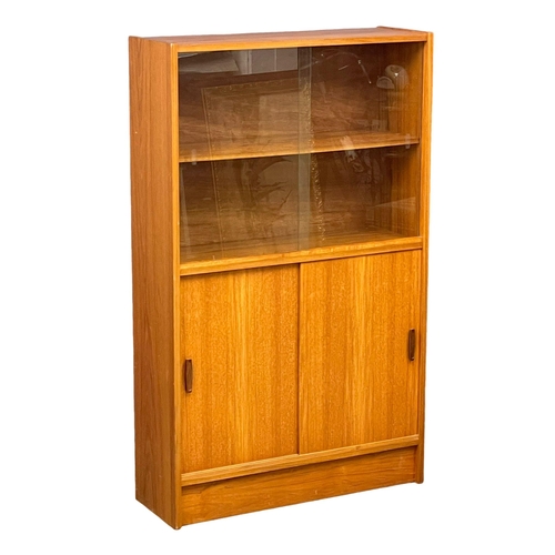 889 - A Mid Century teak bookcase. 83x28x136cm