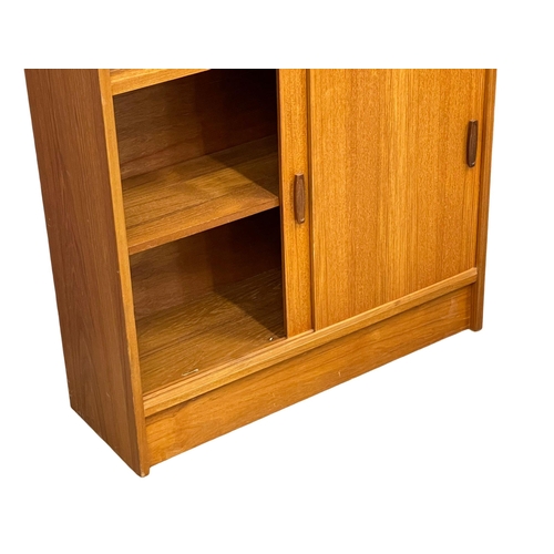 889 - A Mid Century teak bookcase. 83x28x136cm