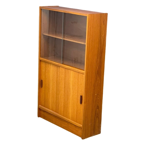 889 - A Mid Century teak bookcase. 83x28x136cm