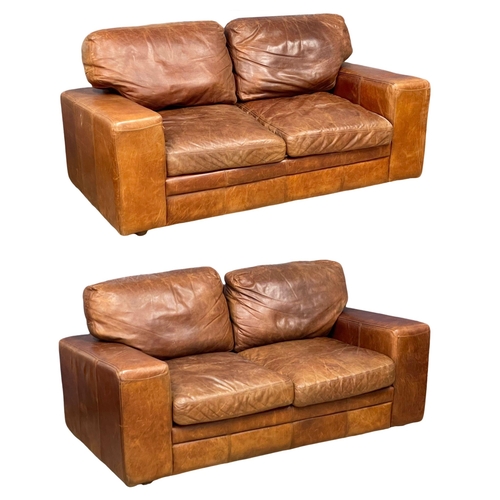 893 - A pair of good quality leather 2 seater sofas. 188cm