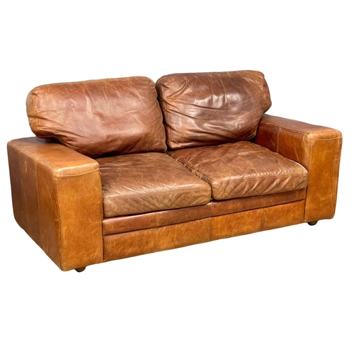 893 - A pair of good quality leather 2 seater sofas. 188cm