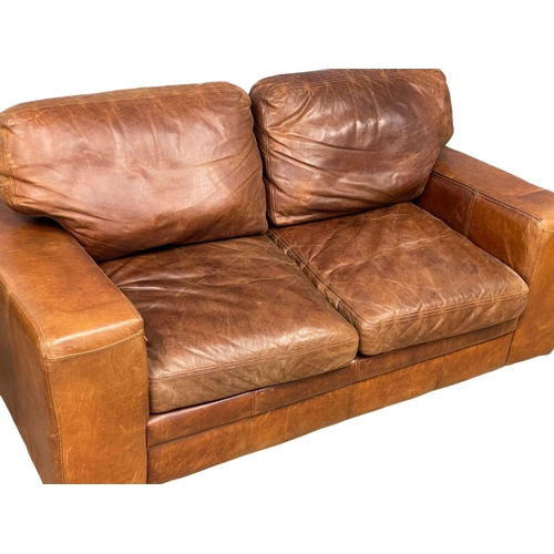 893 - A pair of good quality leather 2 seater sofas. 188cm