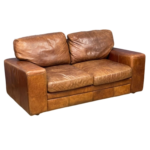 893 - A pair of good quality leather 2 seater sofas. 188cm