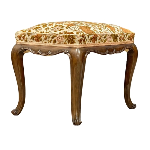 998 - A Victorian mahogany footstool on cabriole legs. 55x41x44cm