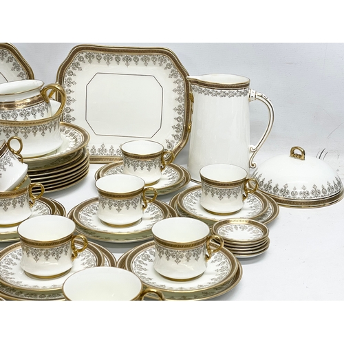 127L - A good quality 72 piece early 20th century Cauldon LTD gilt porcelain tea service.