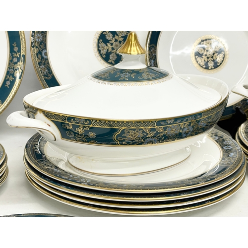 729 - A 30 piece Royal Doulton ‘Carlyle’ dinner set. 12 dinner plates, 2 tureens, 13 salad plates, a servi... 