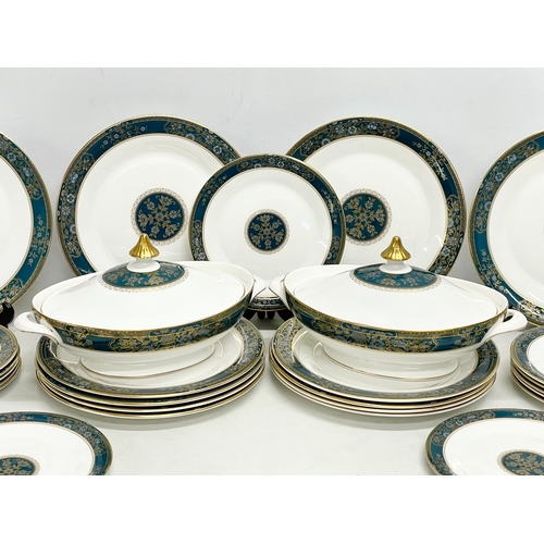 729 - A 30 piece Royal Doulton ‘Carlyle’ dinner set. 12 dinner plates, 2 tureens, 13 salad plates, a servi... 