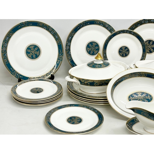 729 - A 30 piece Royal Doulton ‘Carlyle’ dinner set. 12 dinner plates, 2 tureens, 13 salad plates, a servi... 