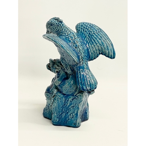 5 - A late 19th century Chinese Guangxu turquoise glazed bird of prey. 1875-1908. 15x19x27cm