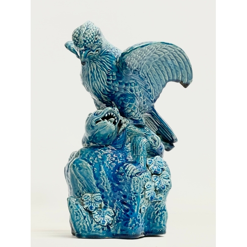 5 - A late 19th century Chinese Guangxu turquoise glazed bird of prey. 1875-1908. 15x19x27cm