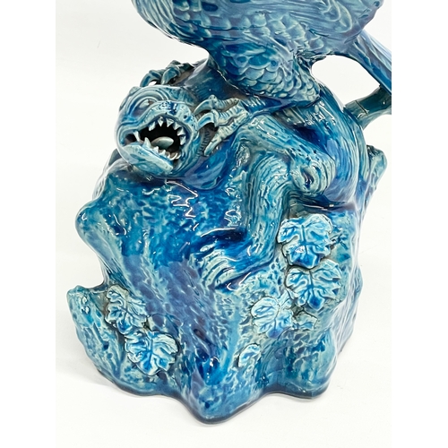 5 - A late 19th century Chinese Guangxu turquoise glazed bird of prey. 1875-1908. 15x19x27cm