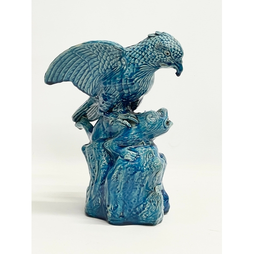 5 - A late 19th century Chinese Guangxu turquoise glazed bird of prey. 1875-1908. 15x19x27cm