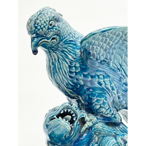 5 - A late 19th century Chinese Guangxu turquoise glazed bird of prey. 1875-1908. 15x19x27cm