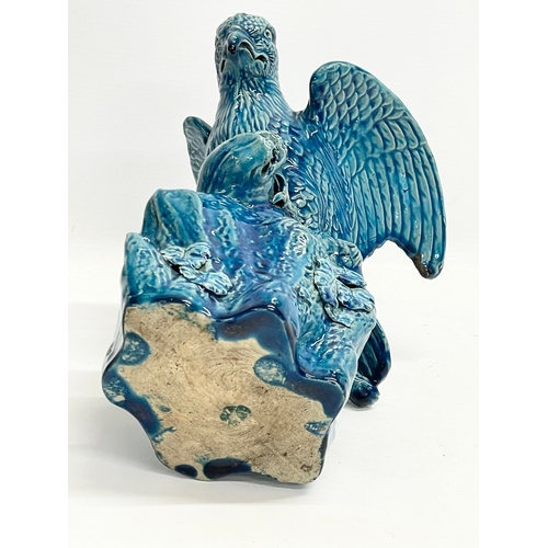 5 - A late 19th century Chinese Guangxu turquoise glazed bird of prey. 1875-1908. 15x19x27cm